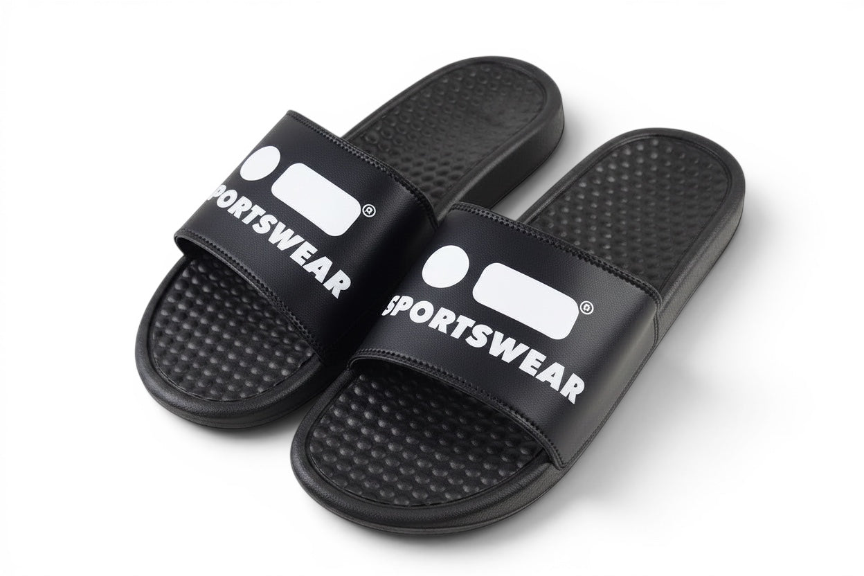 Robfrank.com black sports slides with white logo on the strap, featuring a textured footbed for beach or pool use.